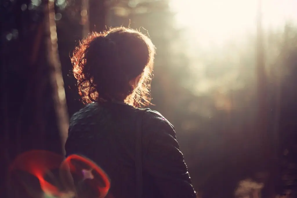 The Backside of a Woman Sitting on a Bench